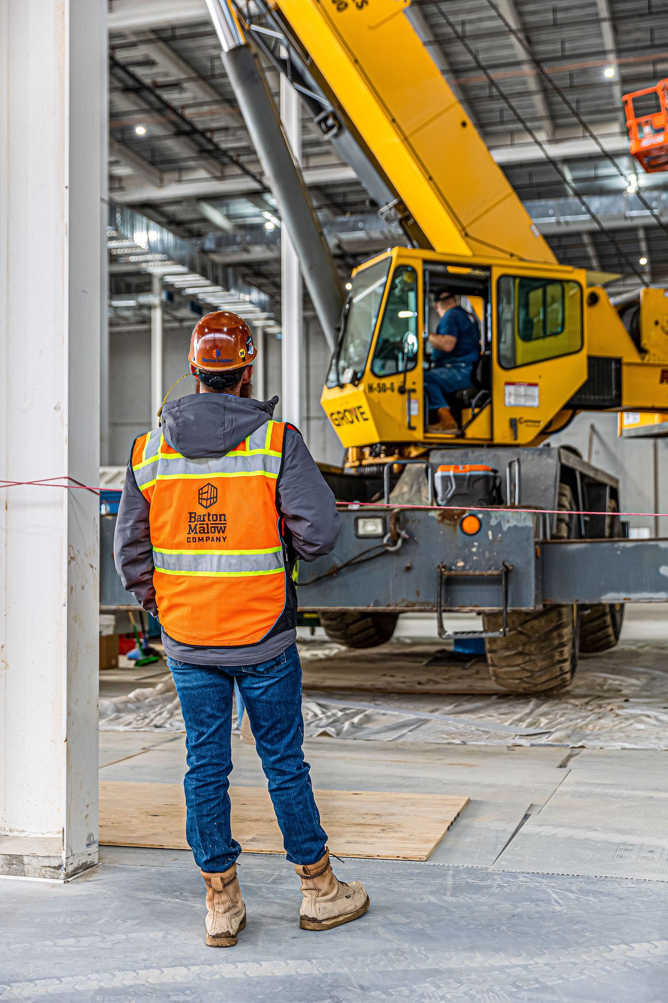 Construction Safety Manager Steve Sisler watching operator of heavy construction equipment