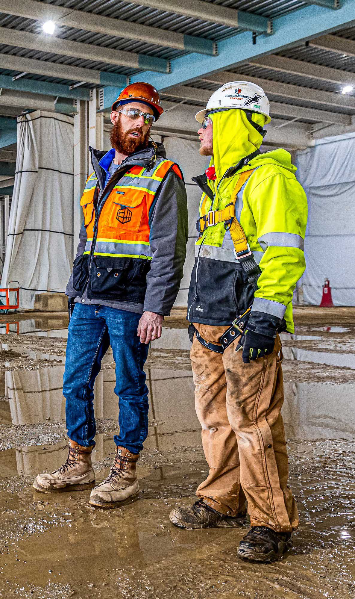 Construction Safety Manager Steve Sisler talking with another construction worker on jobsite